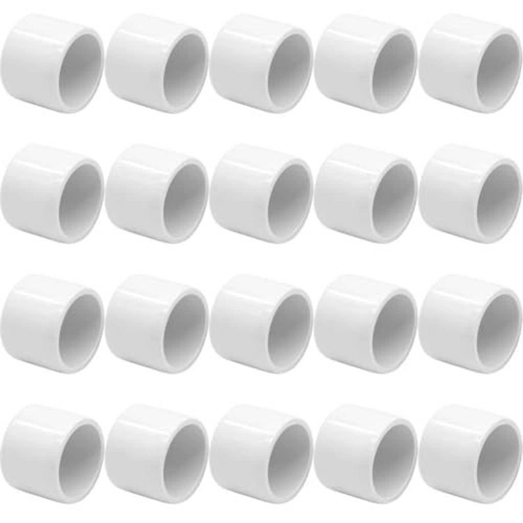 White PVC pipe end caps, round openings, smooth exterior, multiple pieces shown