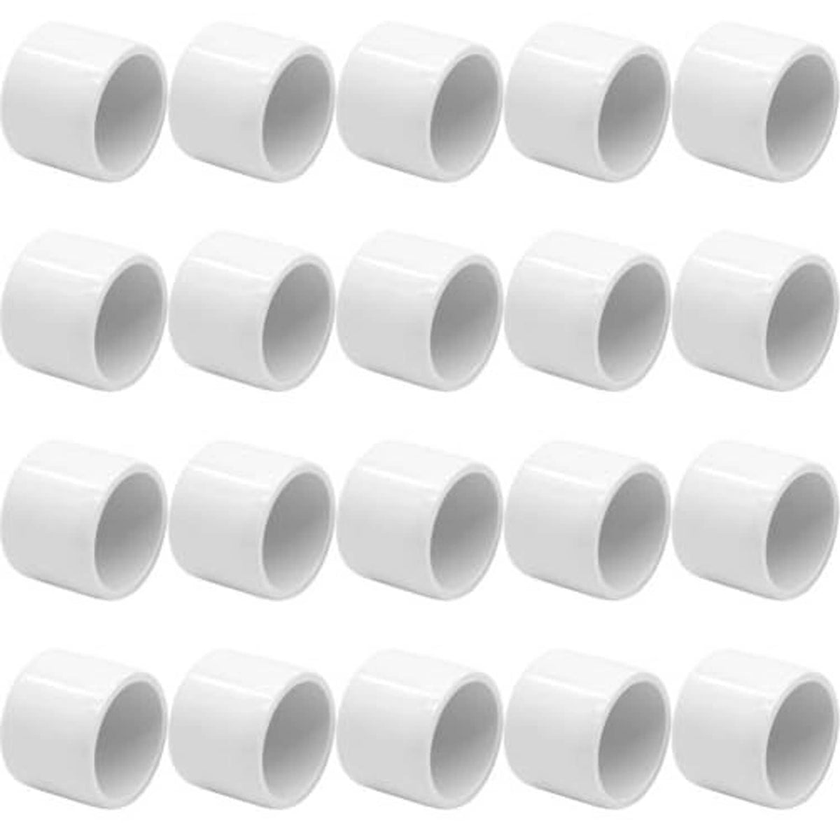 White PVC pipe end caps, round openings, smooth exterior, multiple pieces shown
