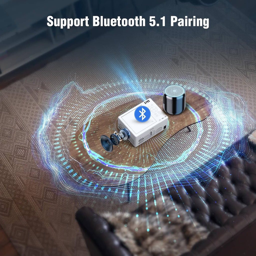 White mini projector with Bluetooth pairing accessory near projector lens