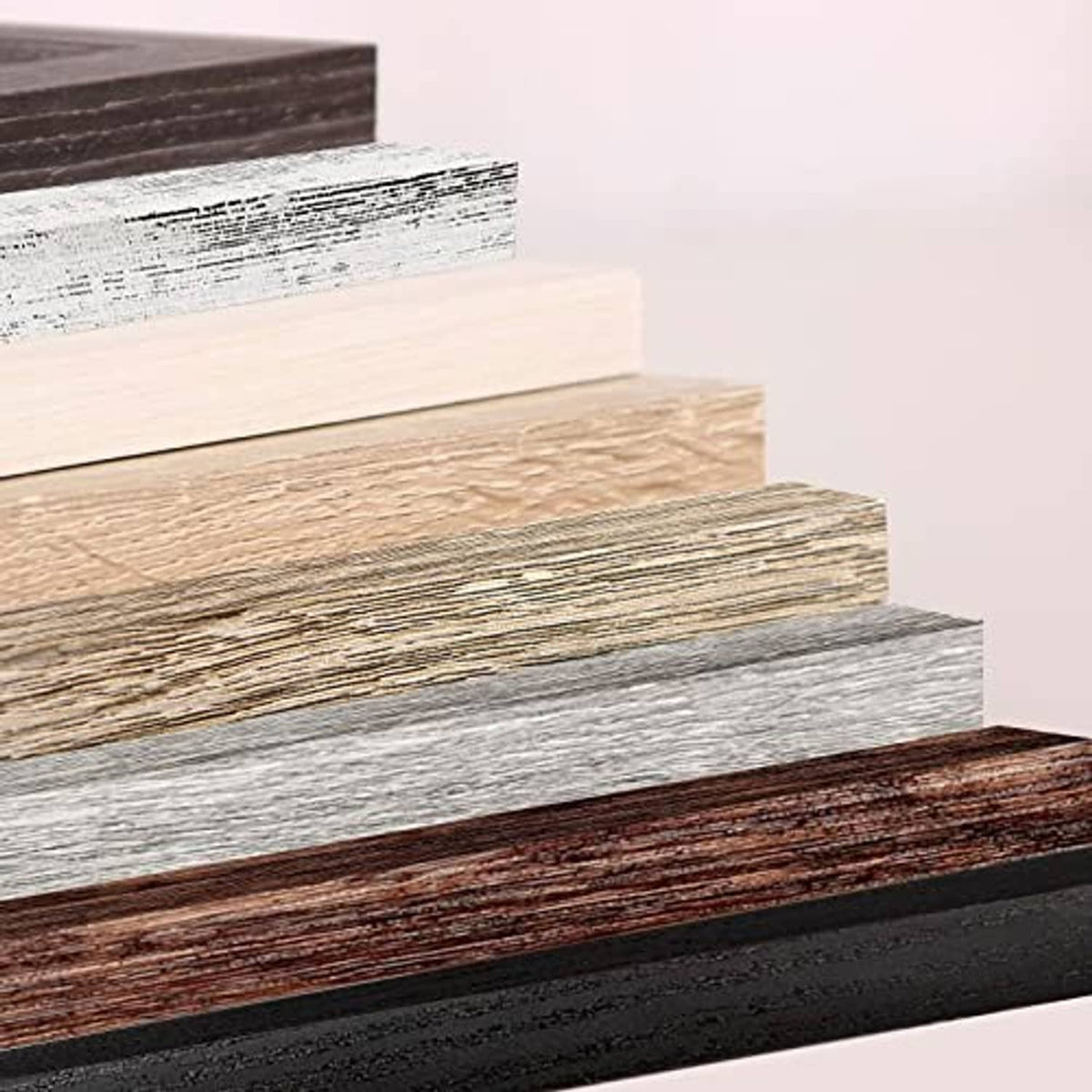 Close-up of distressed wood photo frame edges in mixed brown, gray, and white tones