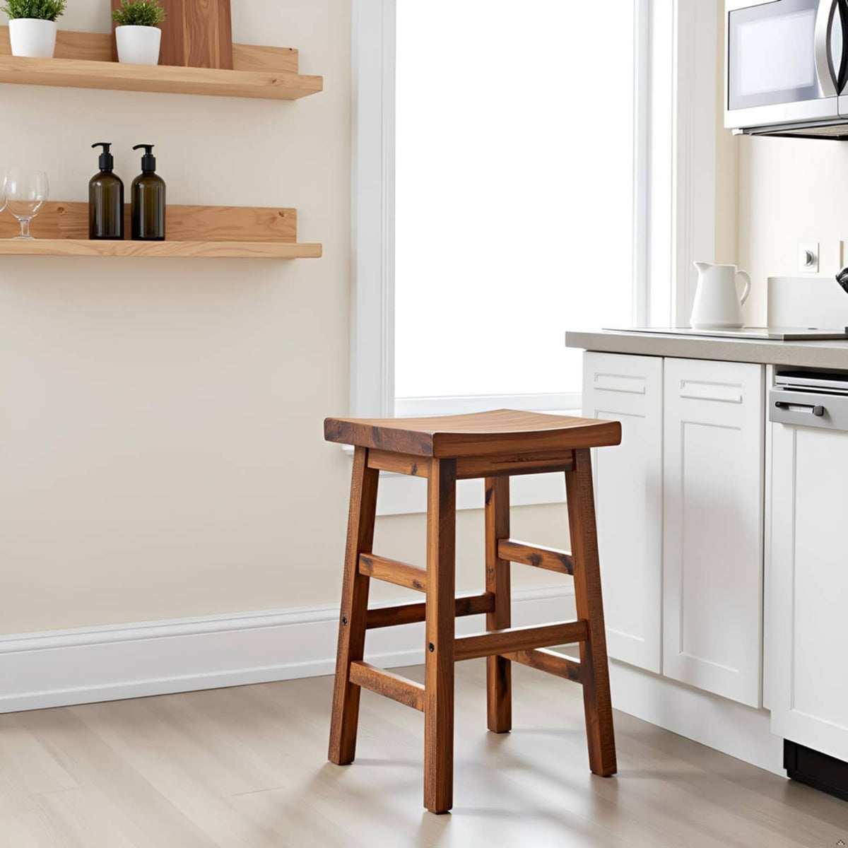Natural wood counter-height bar stool with saddle seat in a home kitchen corner