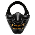 Black half-face demon mask with glowing gold teeth and jagged mouth design