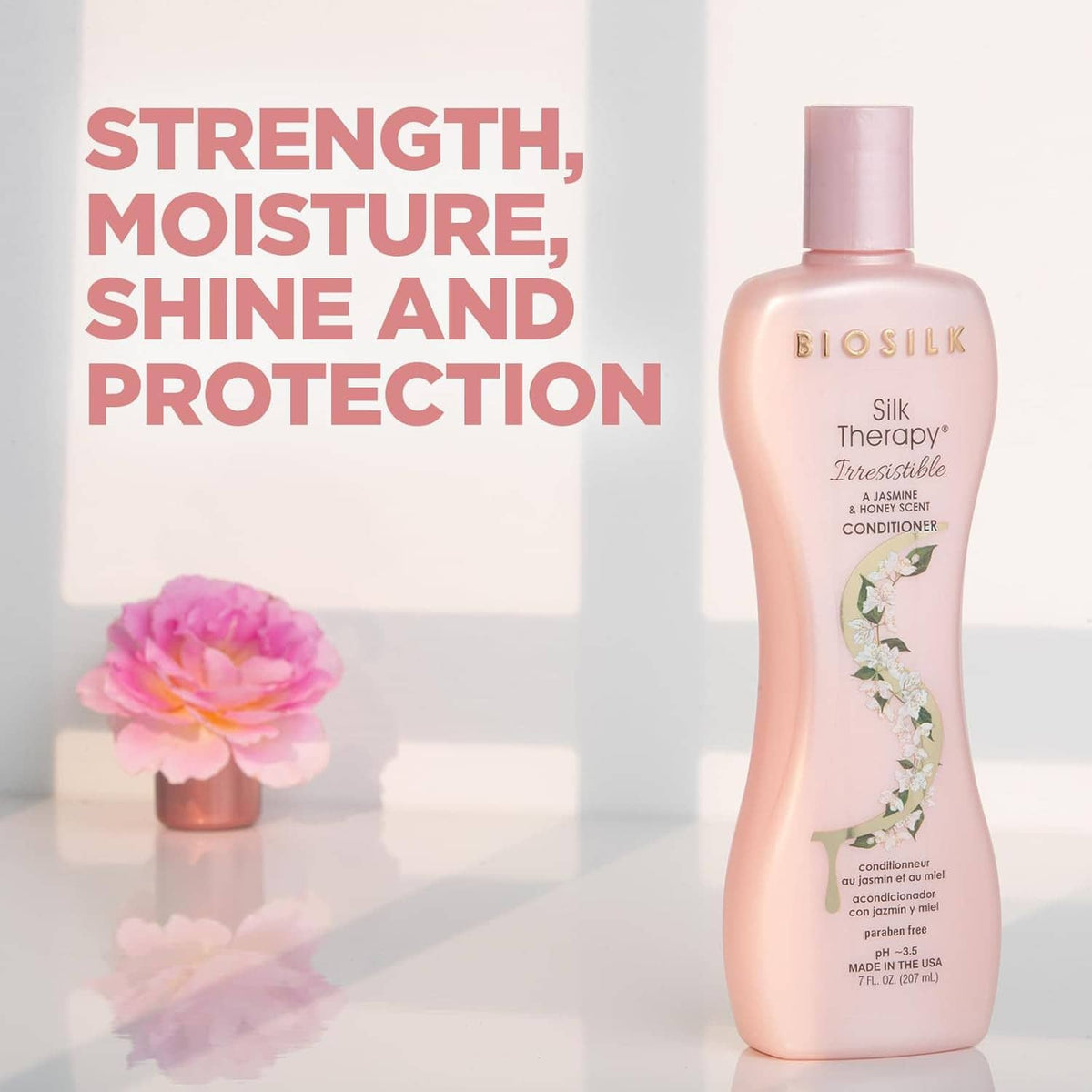 Pink Biosilk Silk Therapy Irresistible conditioner bottle with floral label artwork