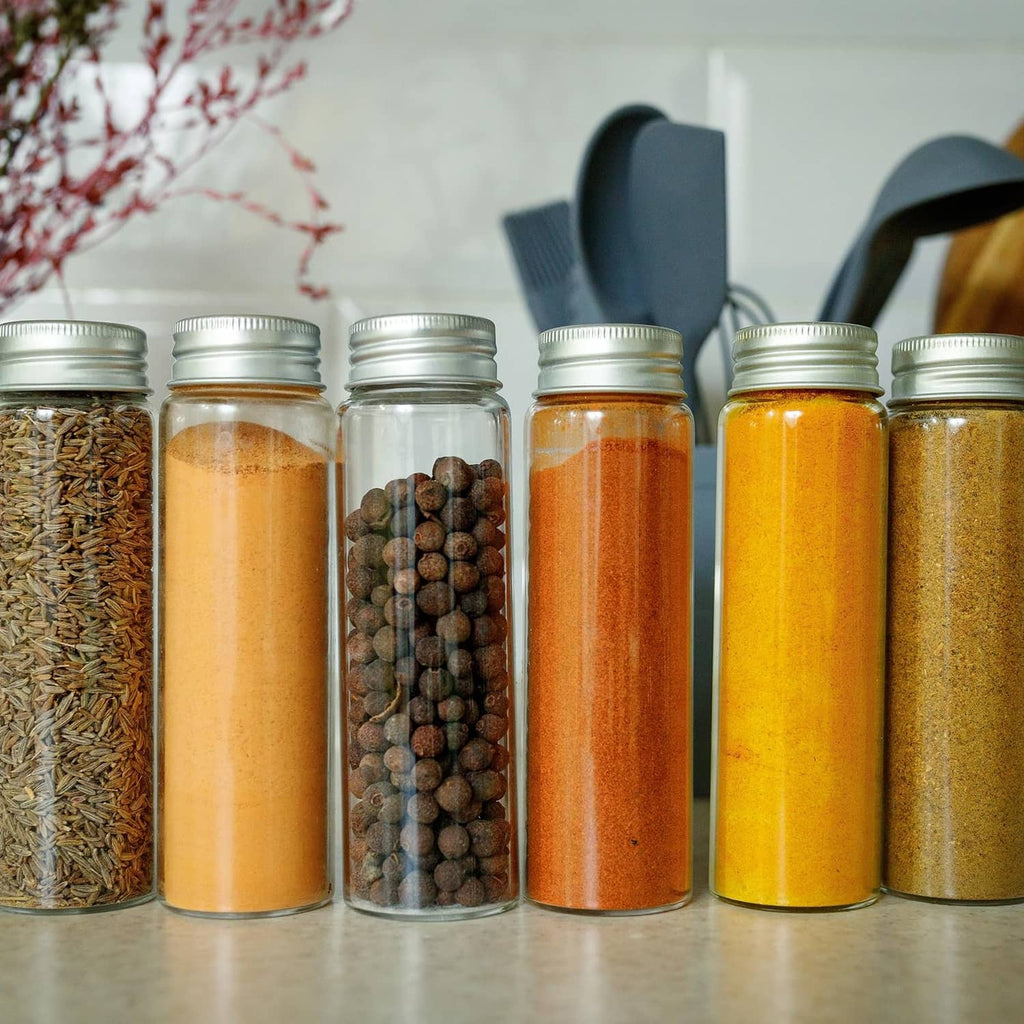 Aluminum bottle cap liners with row of glass spice jars and metal lids