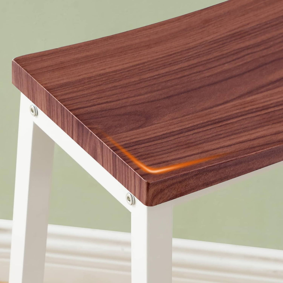 Walnut seat bar stool with rounded corners and white legs, close-up