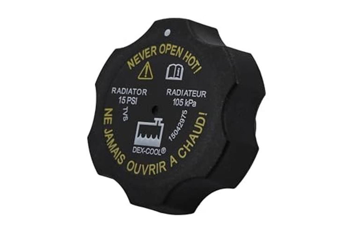 Black radiator cap with multilingual warning icons and 15 PSI labeling