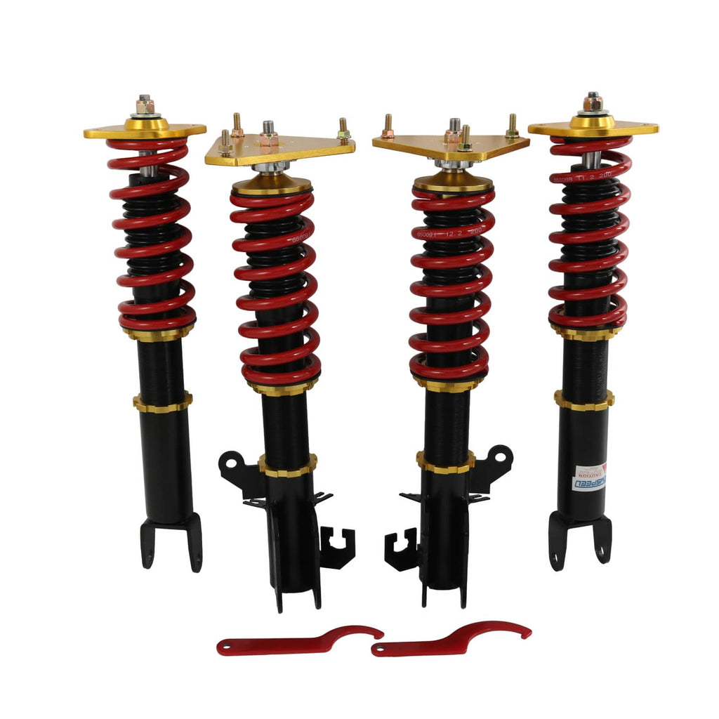 Coilover suspension lowering kit with four black shocks, red coil springs, gold tops
