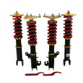 Coilover suspension lowering kit with four black shocks, red coil springs, gold tops