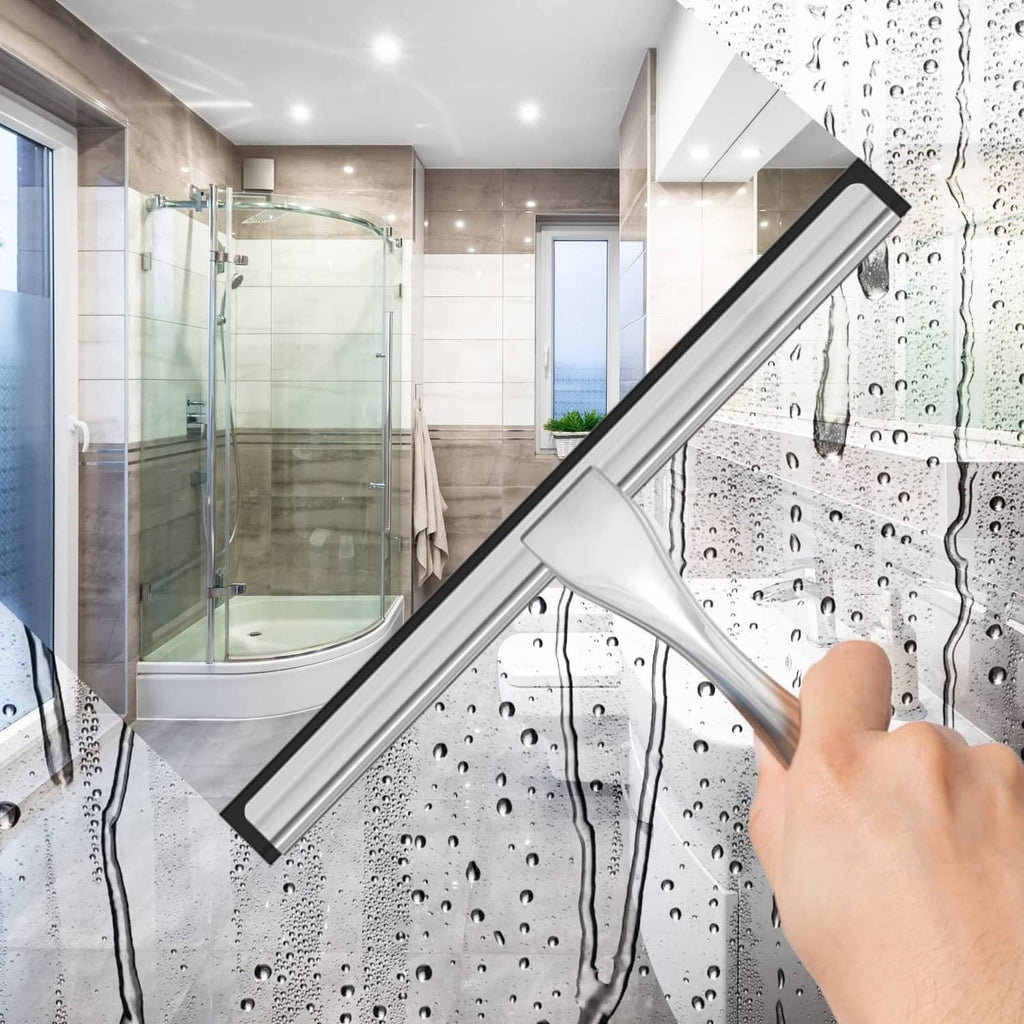 Chrome shower squeegee wiping water from a glass shower door panel.