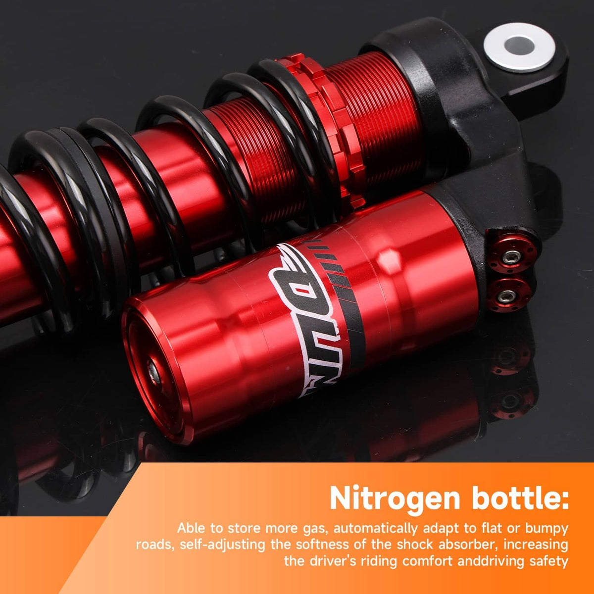 Red and black rear shock absorber with coiled spring and reservoir body