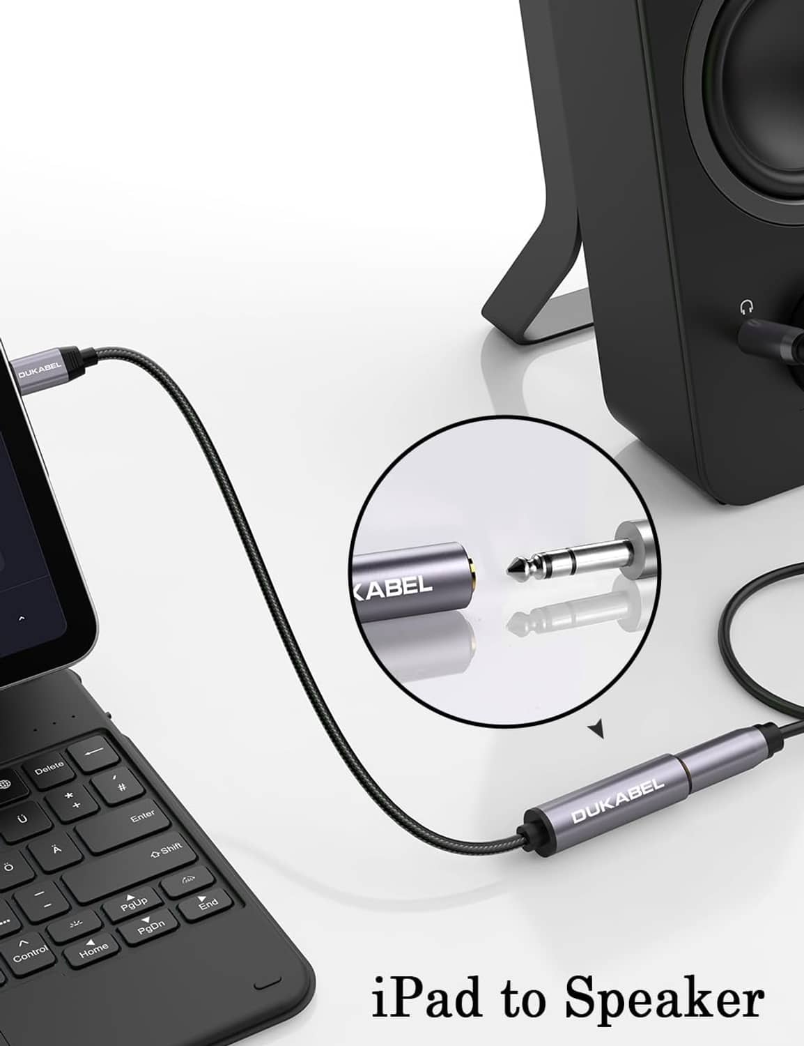 USB-C to 6.35mm headphone adapter cable with grey housing and gold 1/4 audio plug