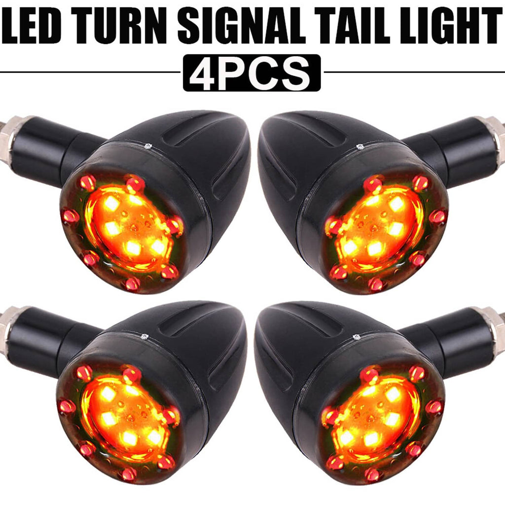 Four motorcycle LED turn signal indicators with amber light bulbs in black housings