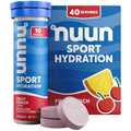 Nuun Sport fruit punch electrolyte tablets in a blue tube with loose tablets