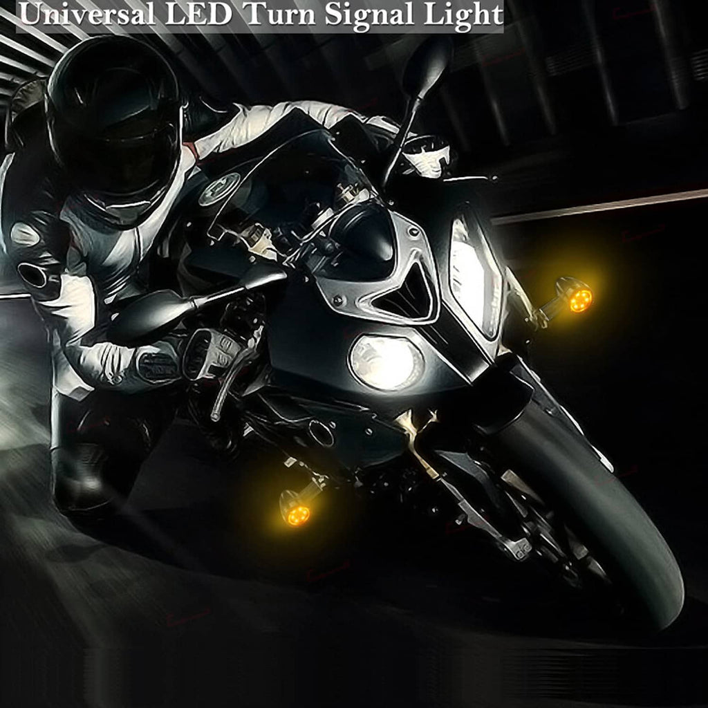 Universal motorcycle LED turn signal lights with amber glow near the handlebar and brake lever