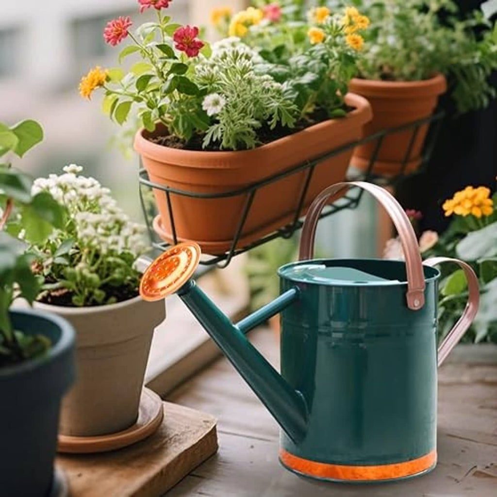Teal metal watering can with rose sprinkler head and curved side handles for indoor or outdoor