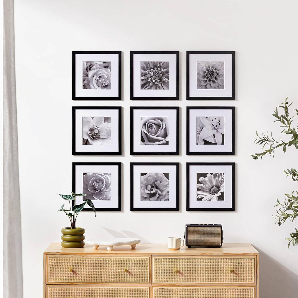 Set of 9 black 12x12 picture frames displaying grayscale floral photos.