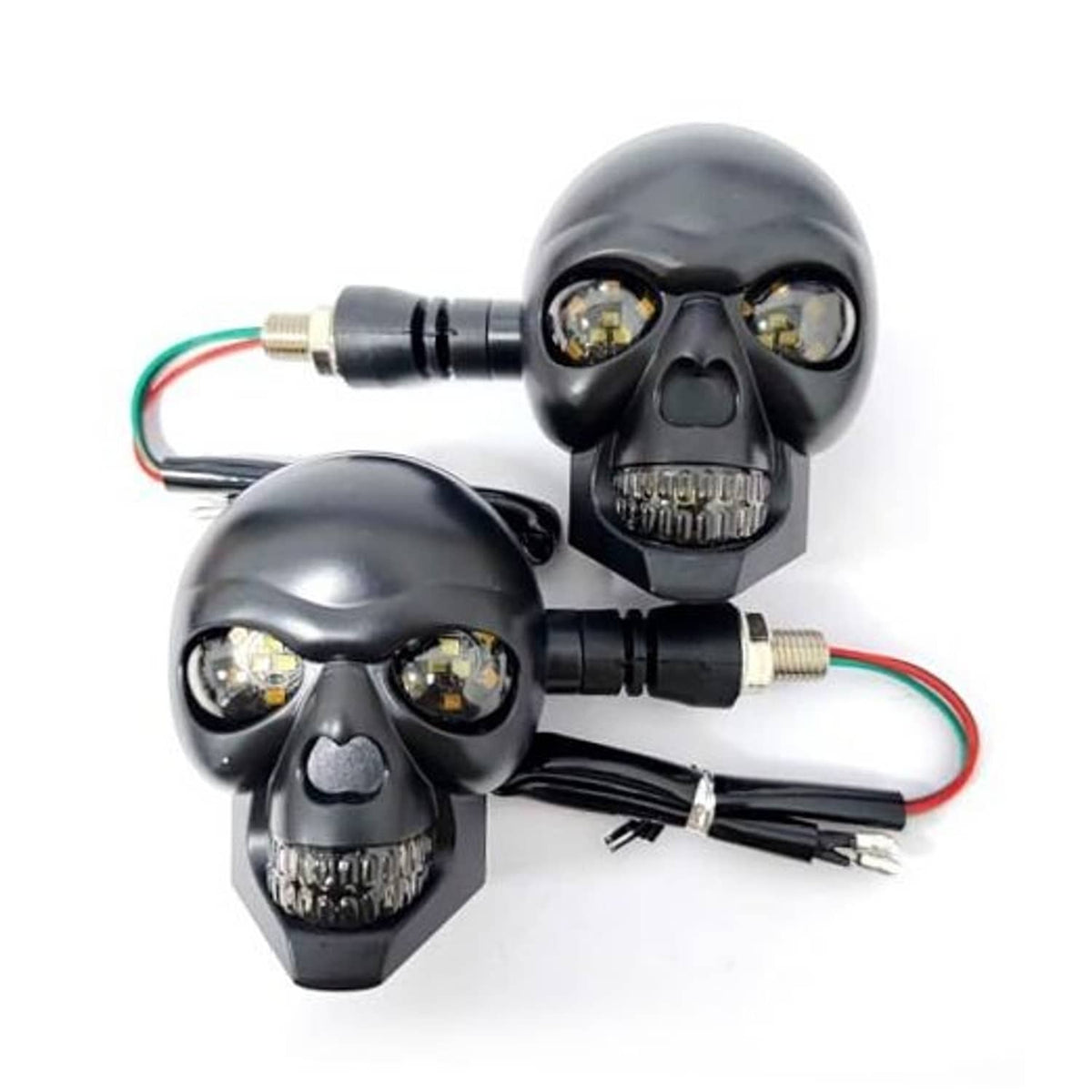 Pair of skull motorcycle turn signal lights with black housings, amber LEDs, and wired leads