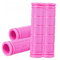 Pink rubber bicycle handlebar grips with textured grid pattern and flared ends
