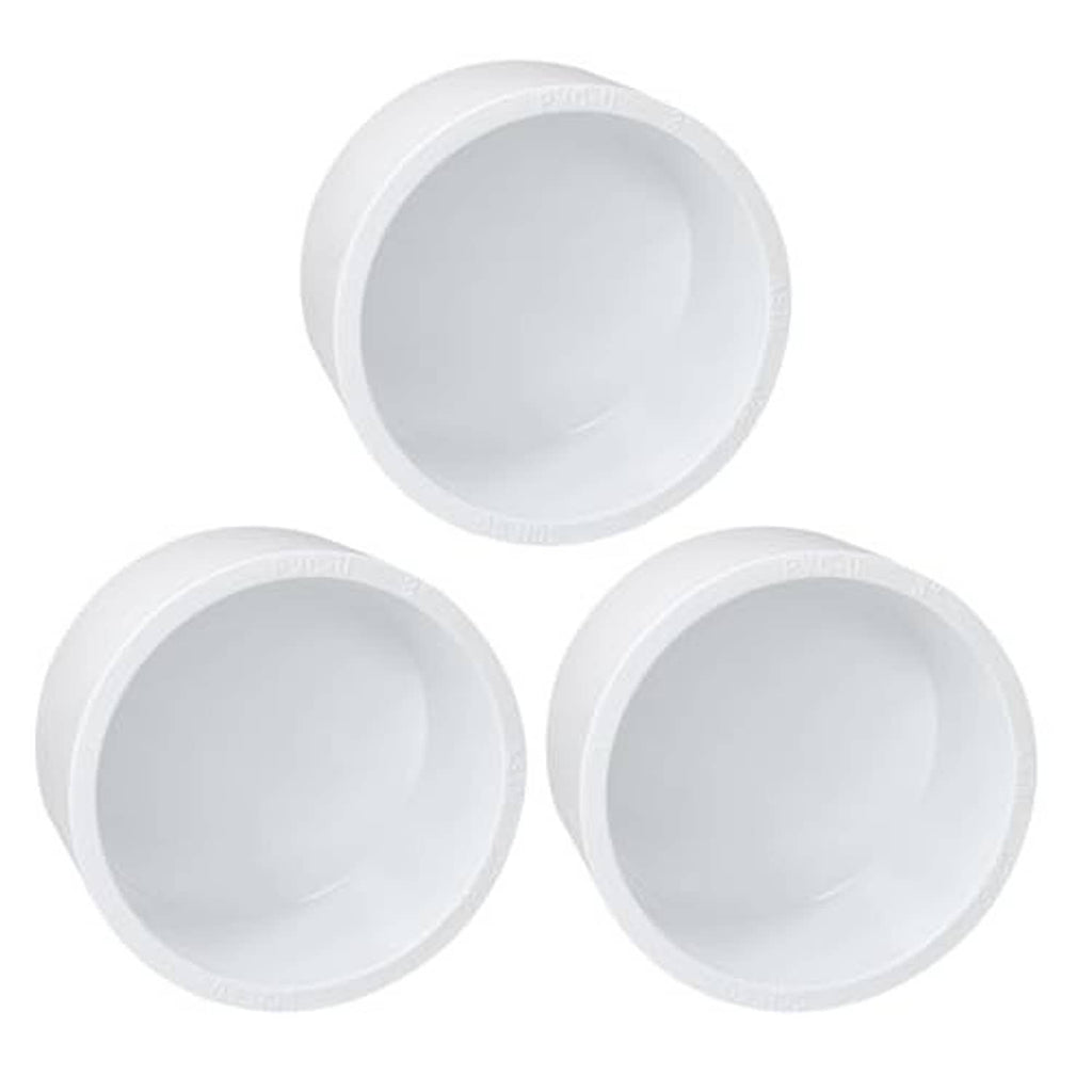 Three white PVC slip-on pipe end caps with round open centers