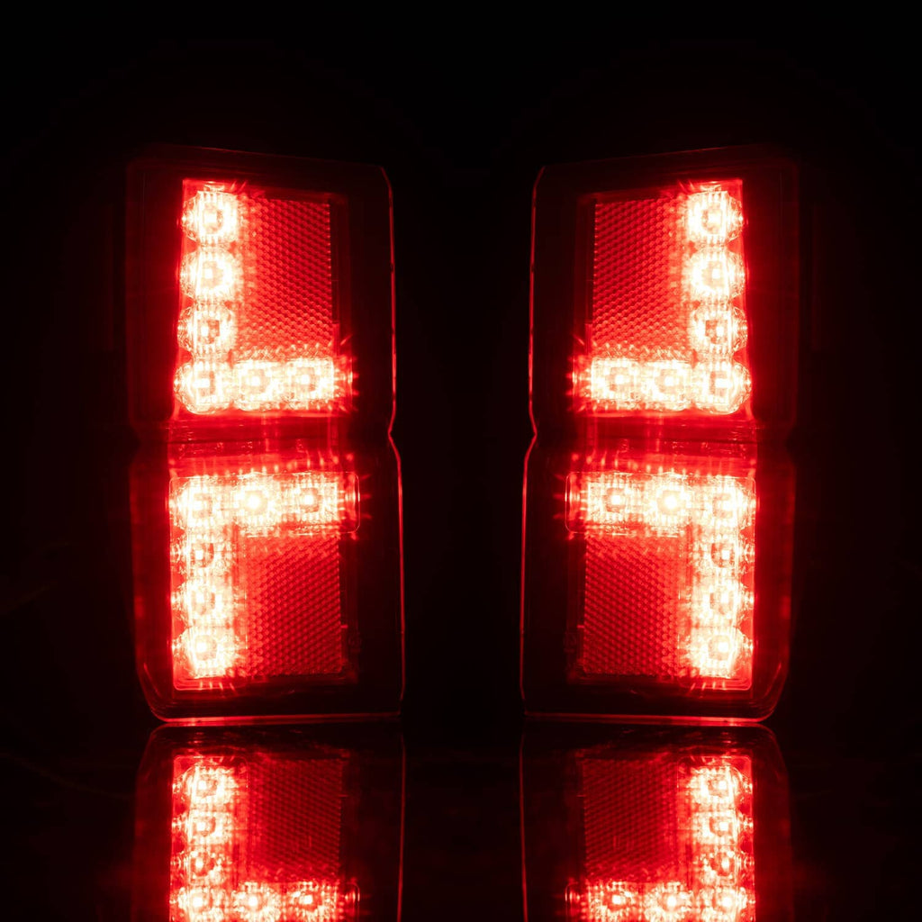 Illuminated red LED rear tail lights with vertical rectangular lens sections