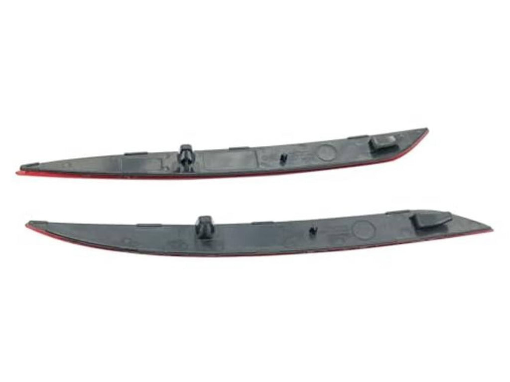 Pair of dark gray trim strips with red reflector lens inserts for rear bumper
