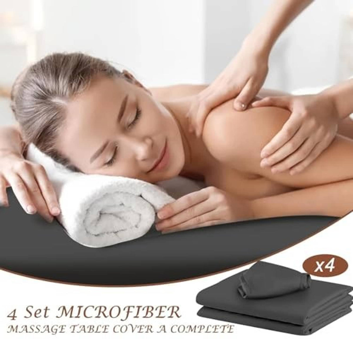 Dark gray massage table sheet with headrest cover in use during a massage
