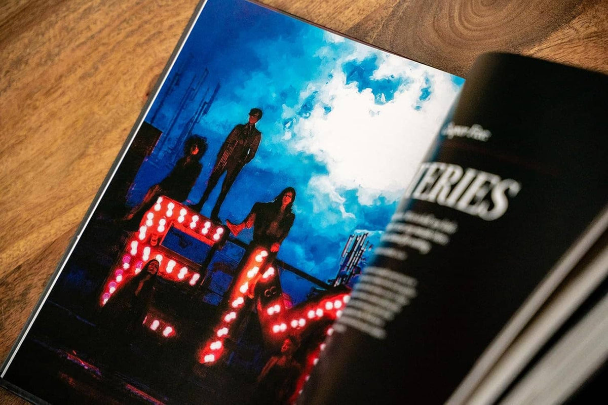 Open hardcover Players Guide showing blue scene with red-lit city lights illustration