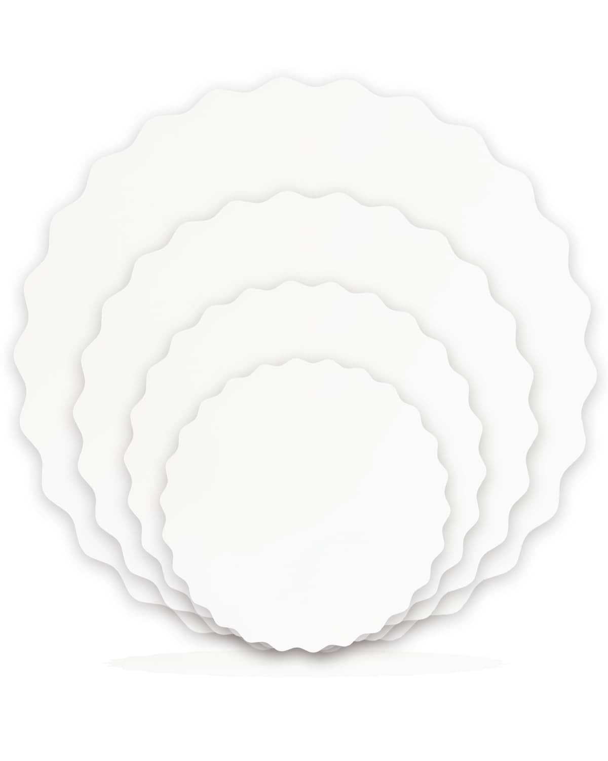 White round wave cake board set with scalloped edges and layered stack