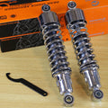 Pair of chrome rear motorcycle shocks with coil springs and mounting eyes