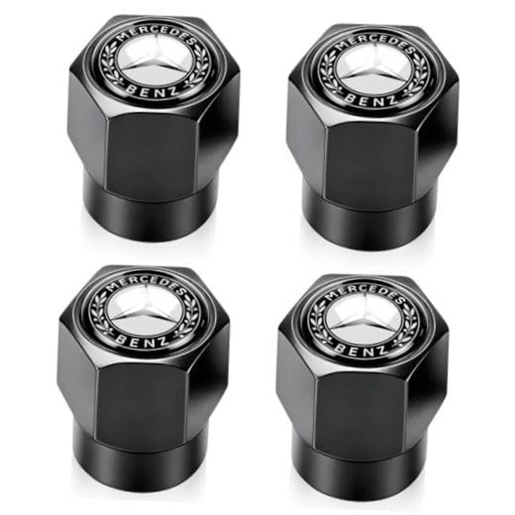 Set of black tire valve stem caps with Mercedes-Benz logo emblems, hex-style finish
