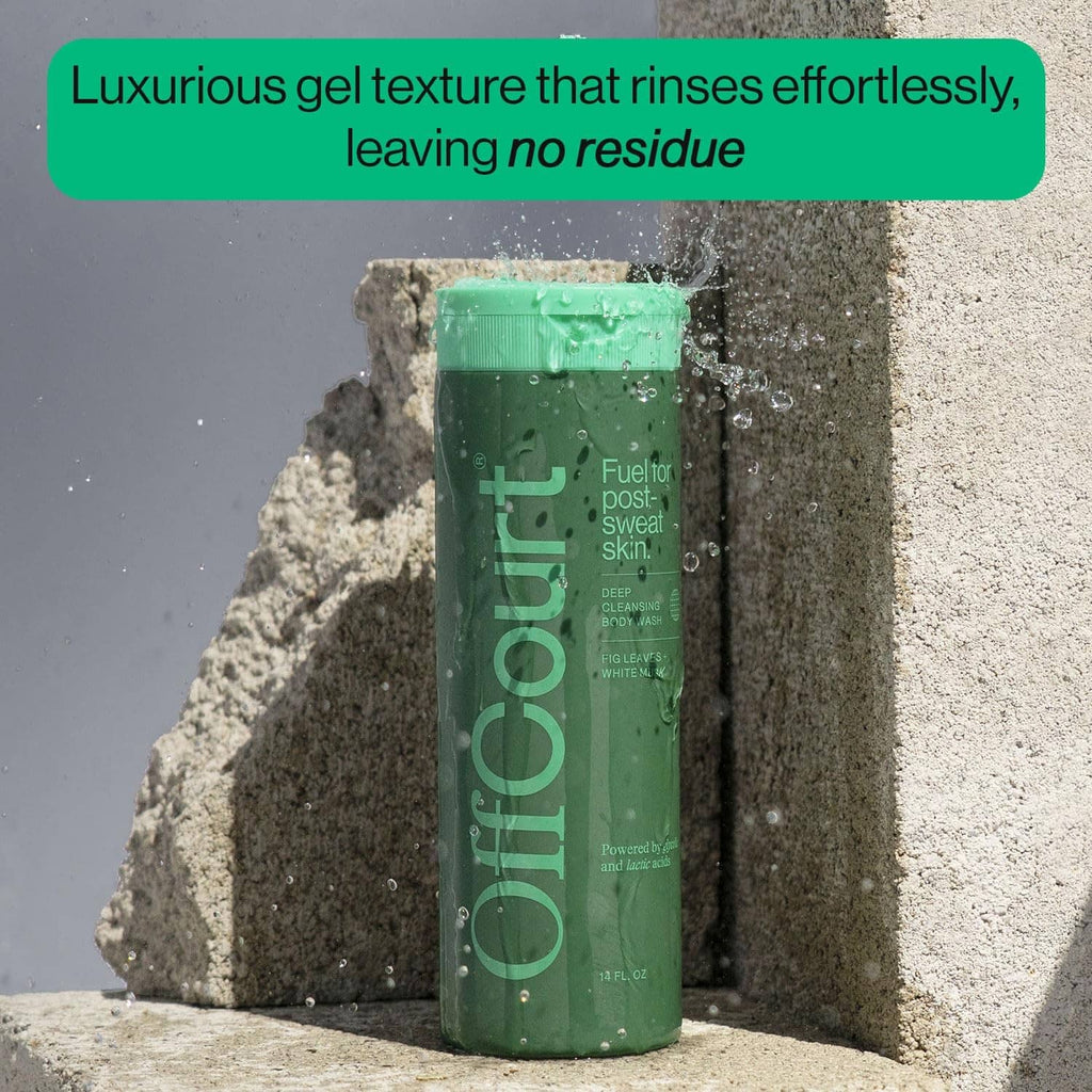 Offcourt green shower gel bottle standing on sandy rocks, 14 fl oz