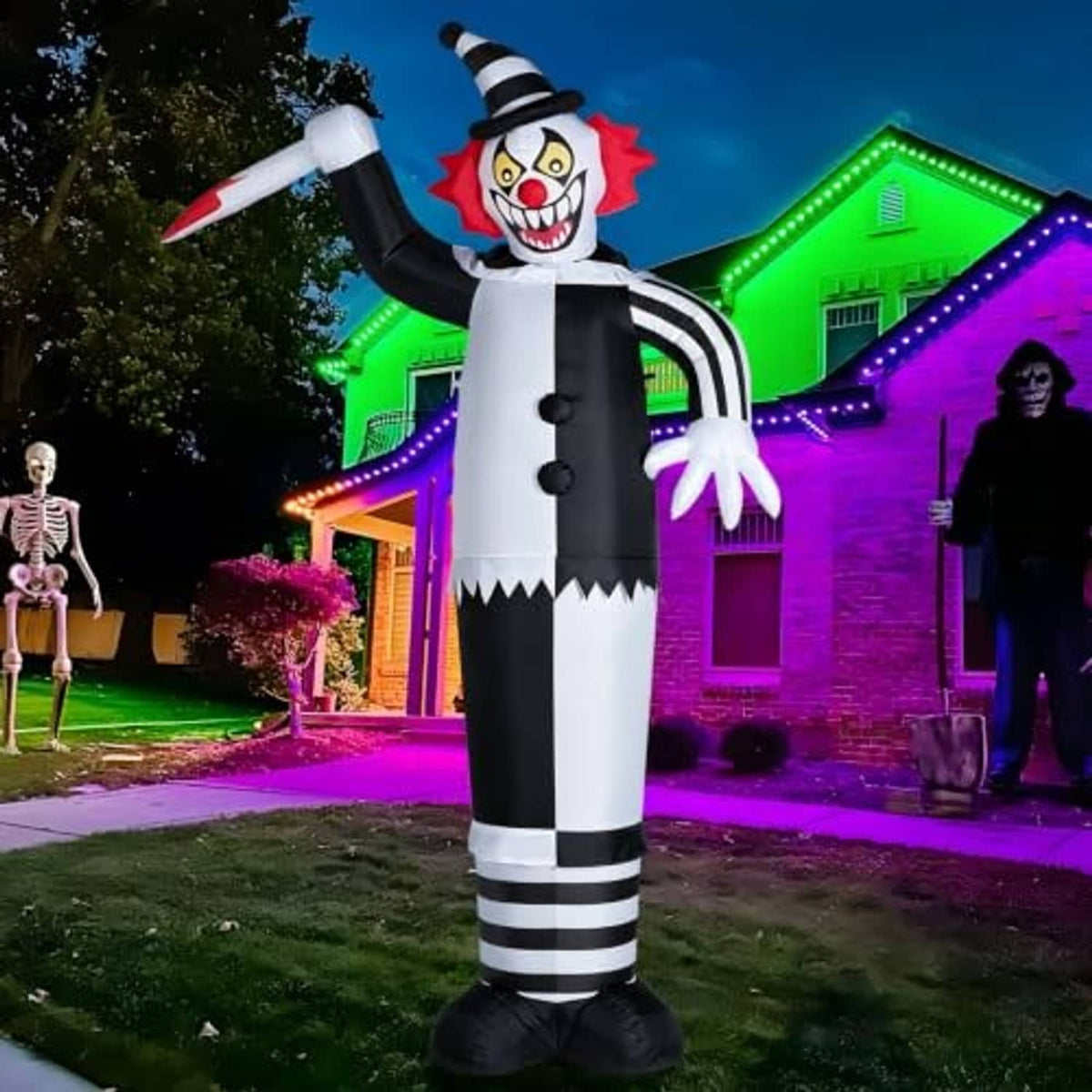 12ft inflatable clown with red grin, white torso, black jacket, and striped lower pants