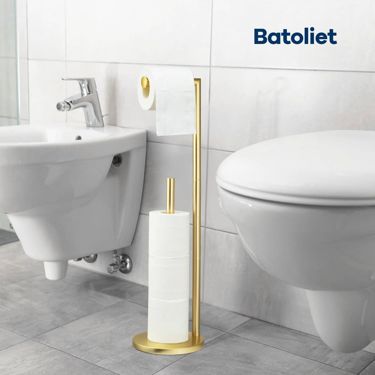 Freestanding toilet paper roll stand with tall gold base and white holder