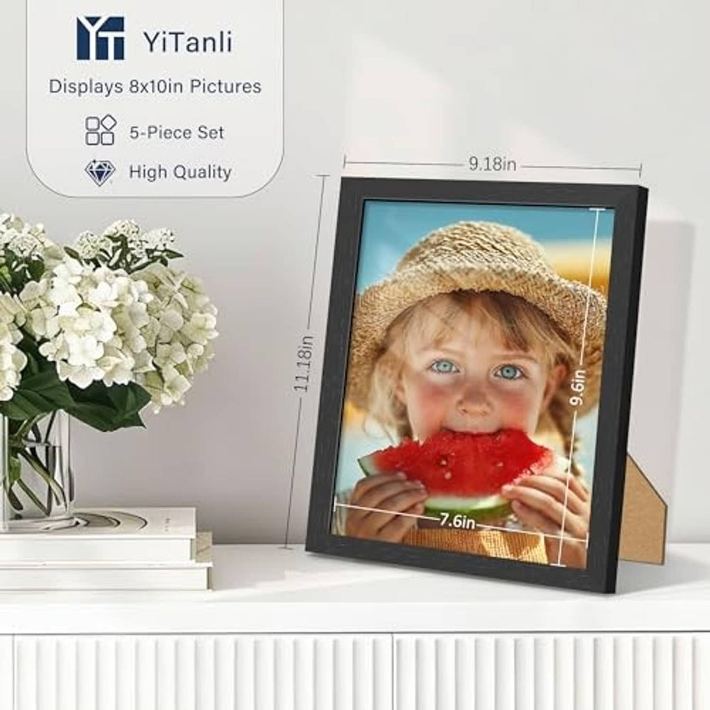 Black 8x10 solid wood picture frame standing upright with child photo