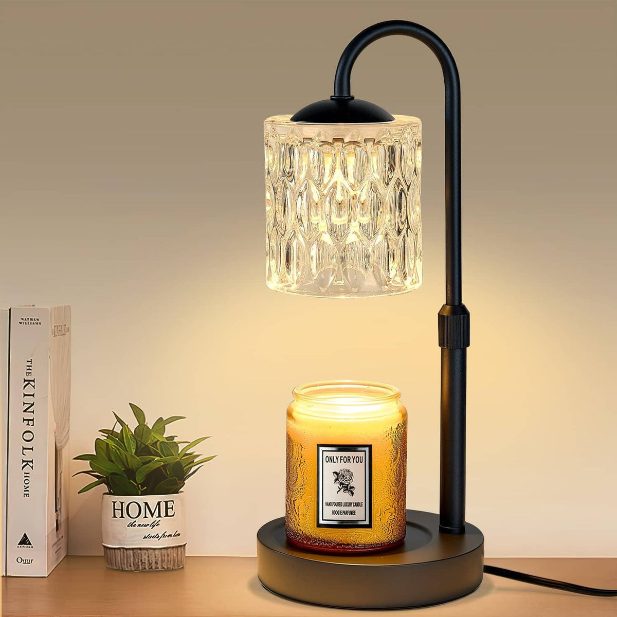 Height-adjustable candle warmer lamp with black base and clear glass shade