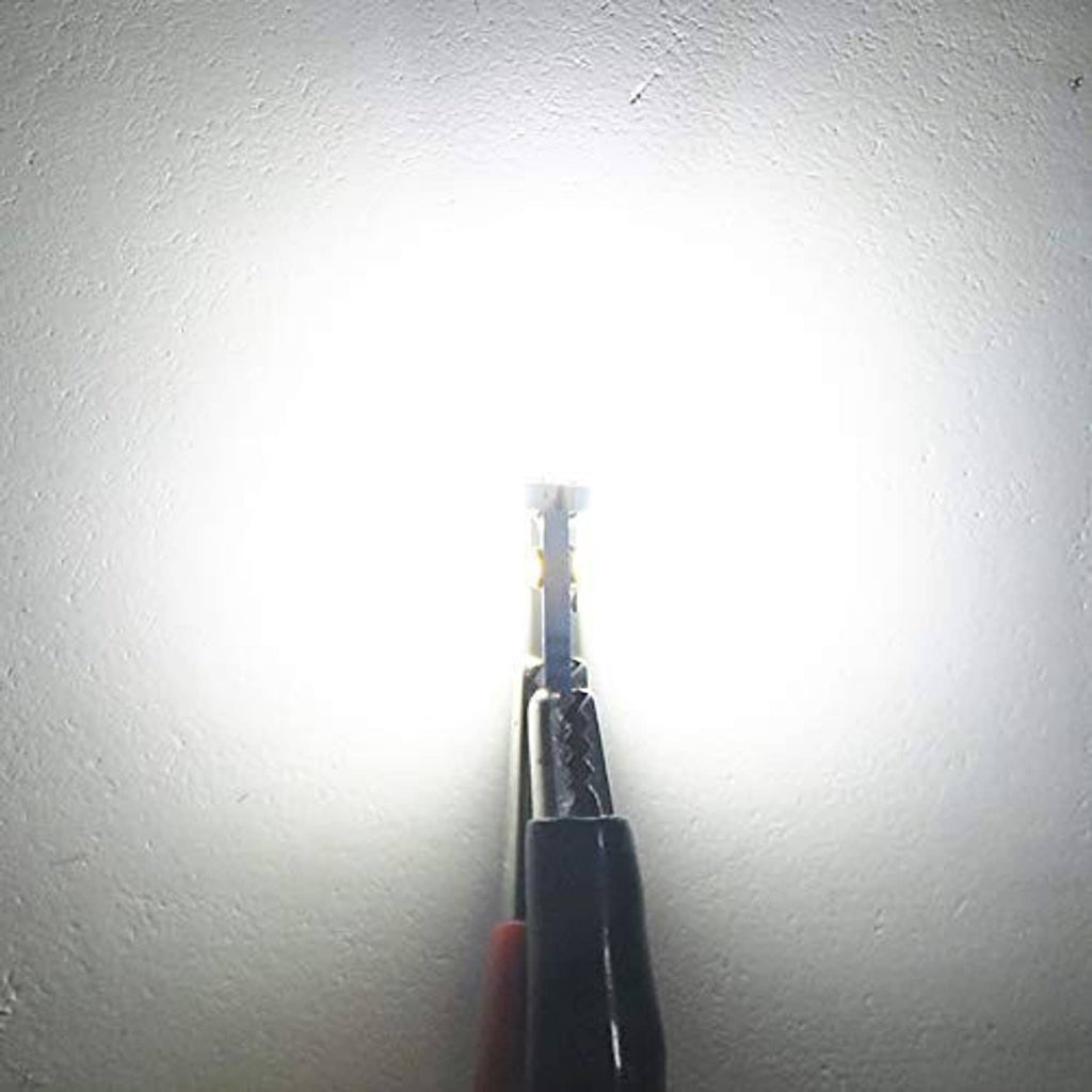 T5 LED bulb close-up with metal leads and a white LED chip on black base