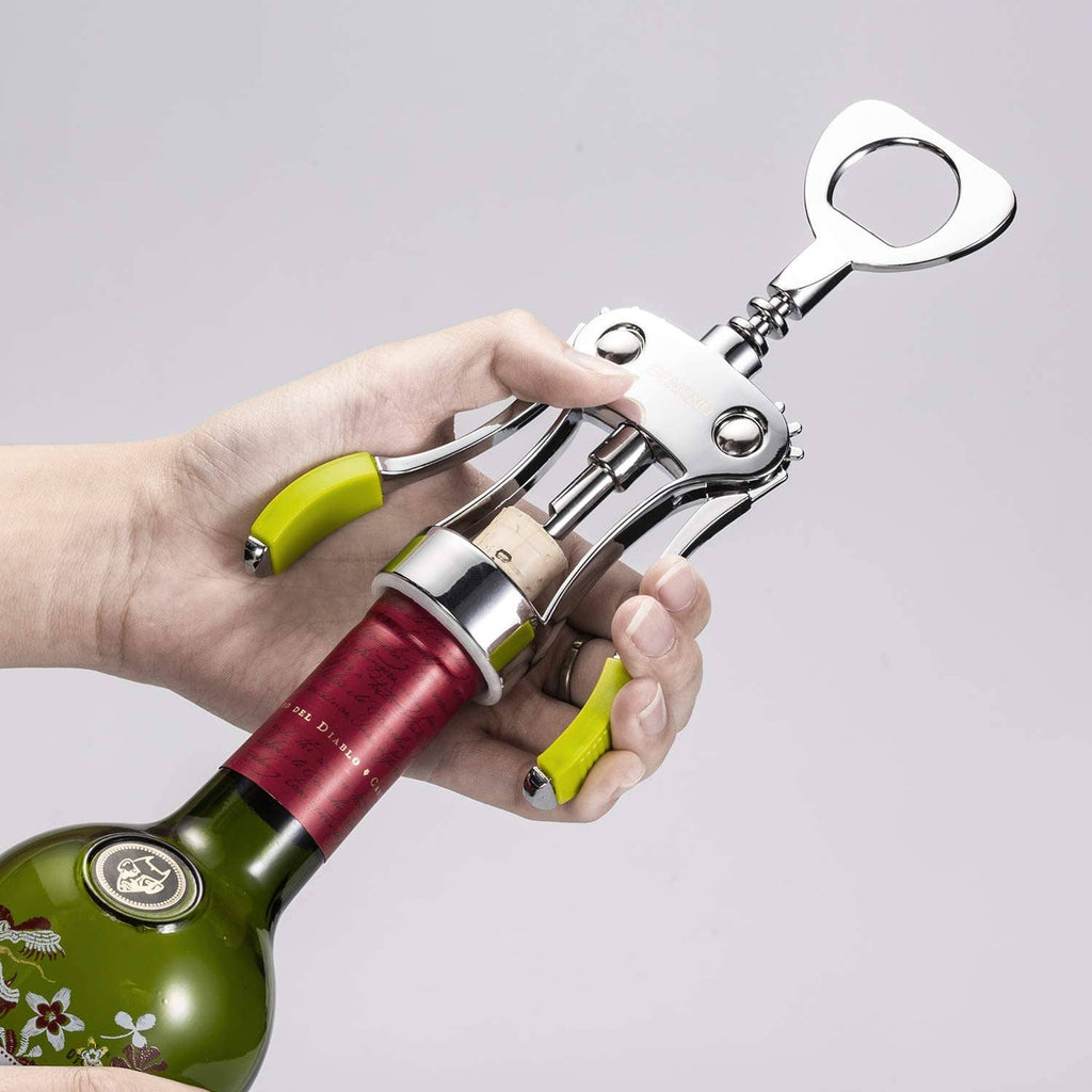 Wing corkscrew wine opener held over a wine bottle with green grip handles