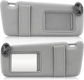 Gray car sun visors pair with mirror cutouts and mounting brackets, left and right