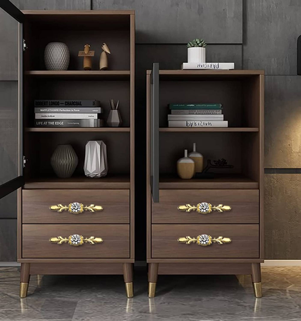Gold decorative crystal knobs with clear faceted stones on wooden cabinet drawers (pair)