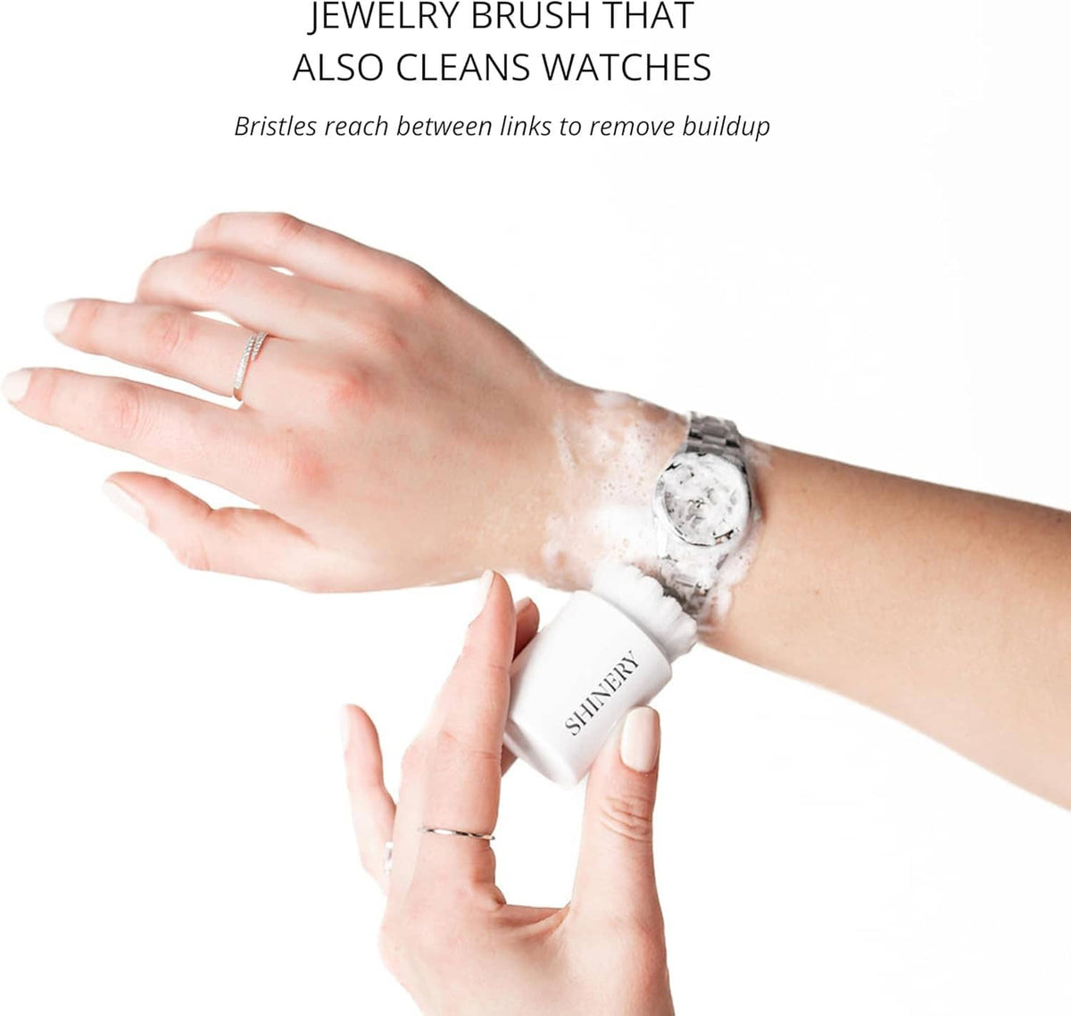 Radiance brush cleaning jewelry and watches, held in hand with bristle head