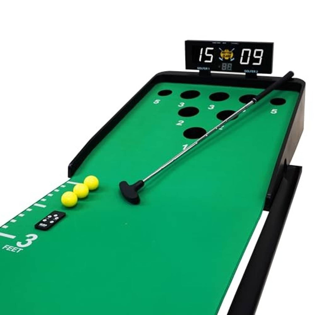 Green putting mat with cup holes, silver putter, and black digital scoreboard