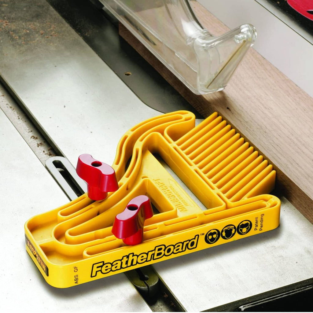 Yellow featherboard with red clamp heads and fence slats on a table saw guide