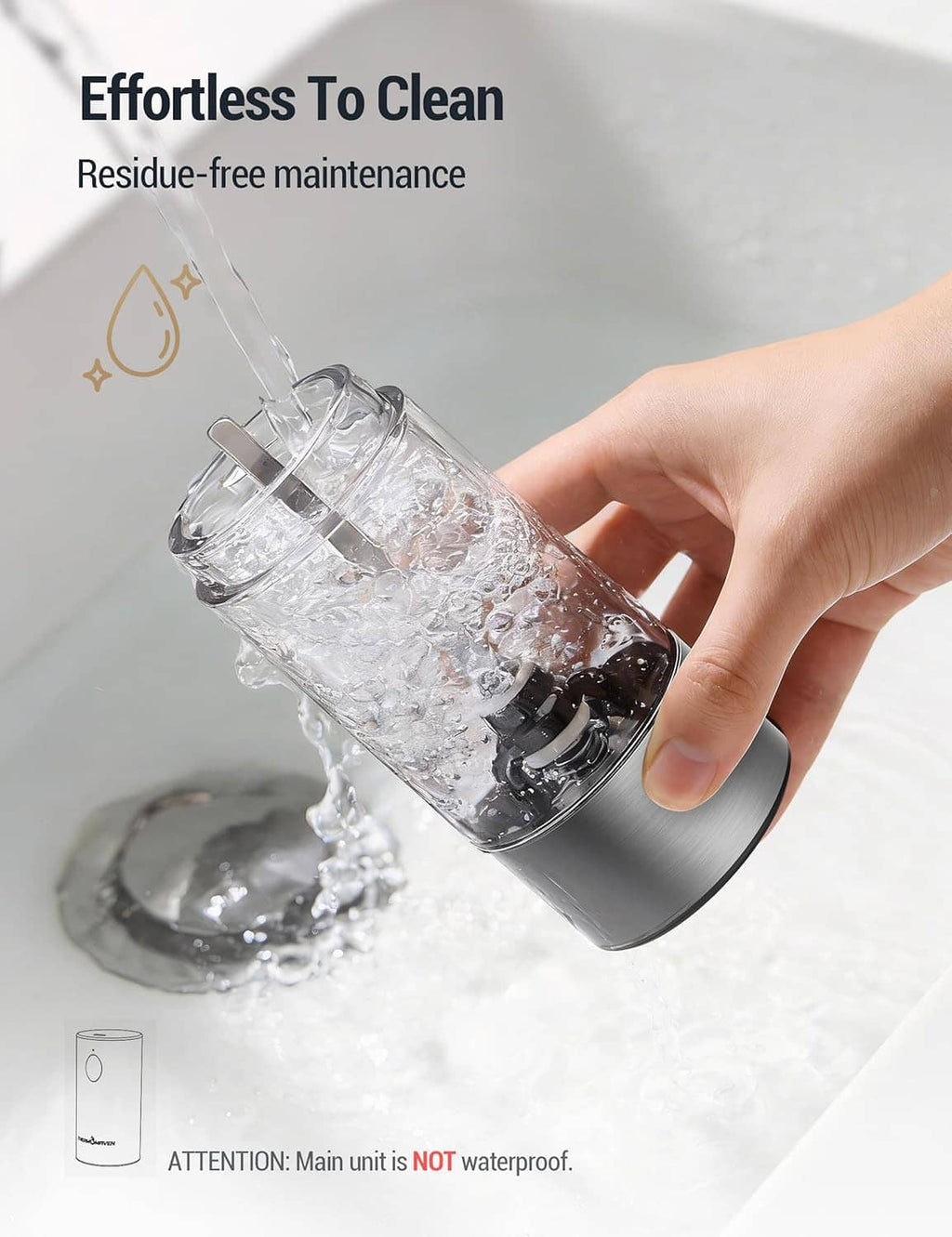 Stainless THERMOMAVEN electric salt and pepper grinder being rinsed with water for cleaning
