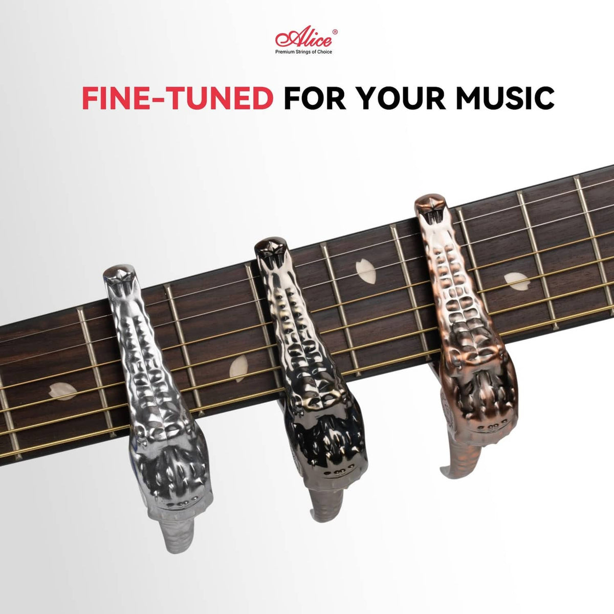 Set of three alligator-style guitar capos with metallic finish