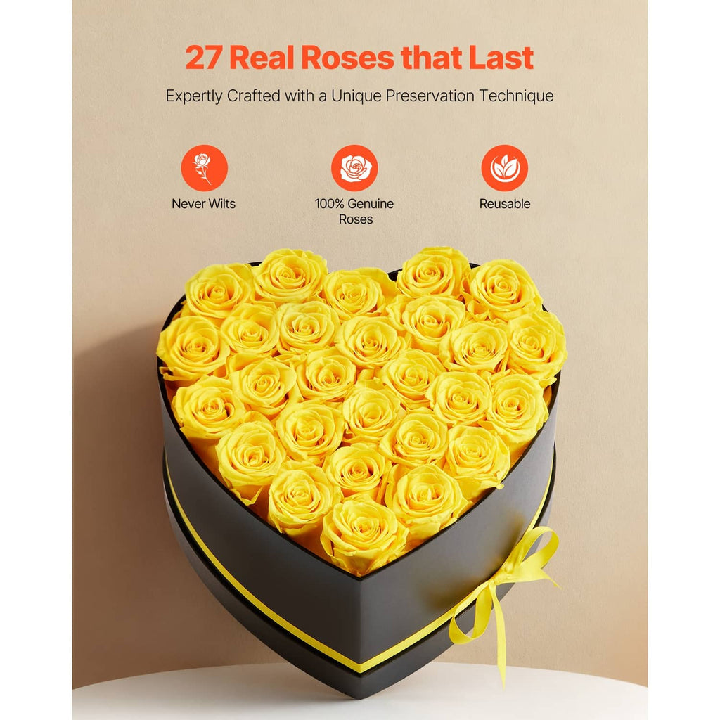 Heart-shaped black rose box filled with yellow preserved roses and yellow ribbon