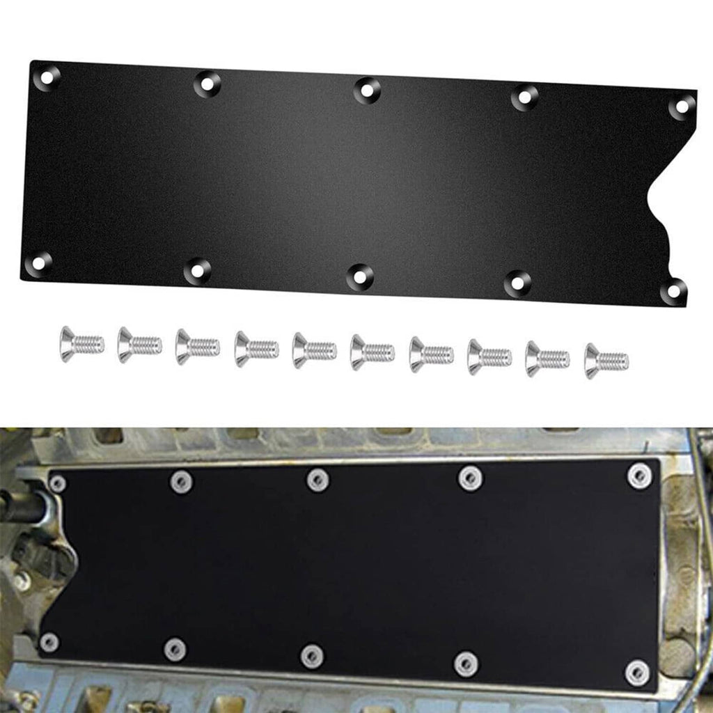 Black billet aluminum valley pan cover plate with mounting bolts on vehicle