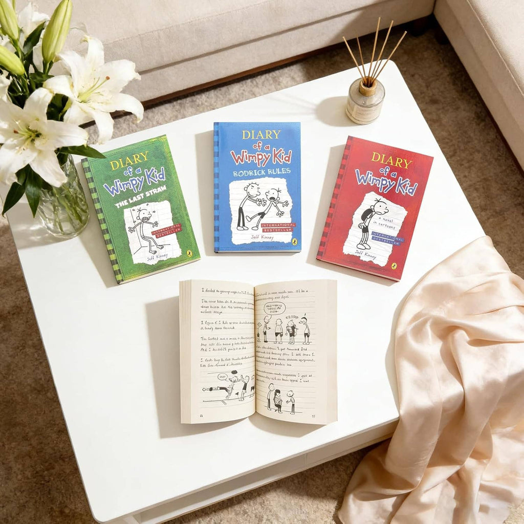 Diary of a Wimpy Kid paperback books with colorful covers on a table