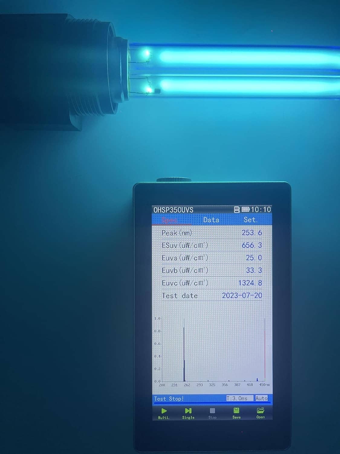 Blue-lit UV germicidal bulb installed in a tank, with control display nearby