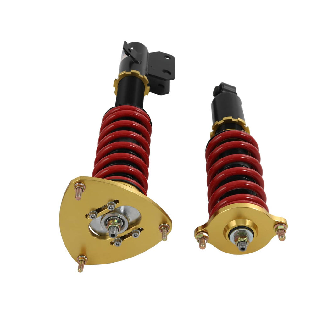 Coilover struts close-up: red springs, black bodies, gold top plates and mounting brackets