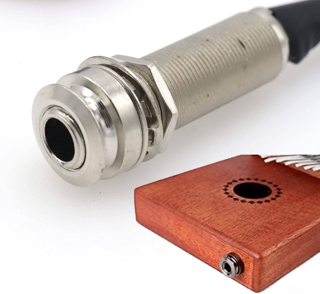 1/4-inch output plug near wooden contact block for piezo pickup